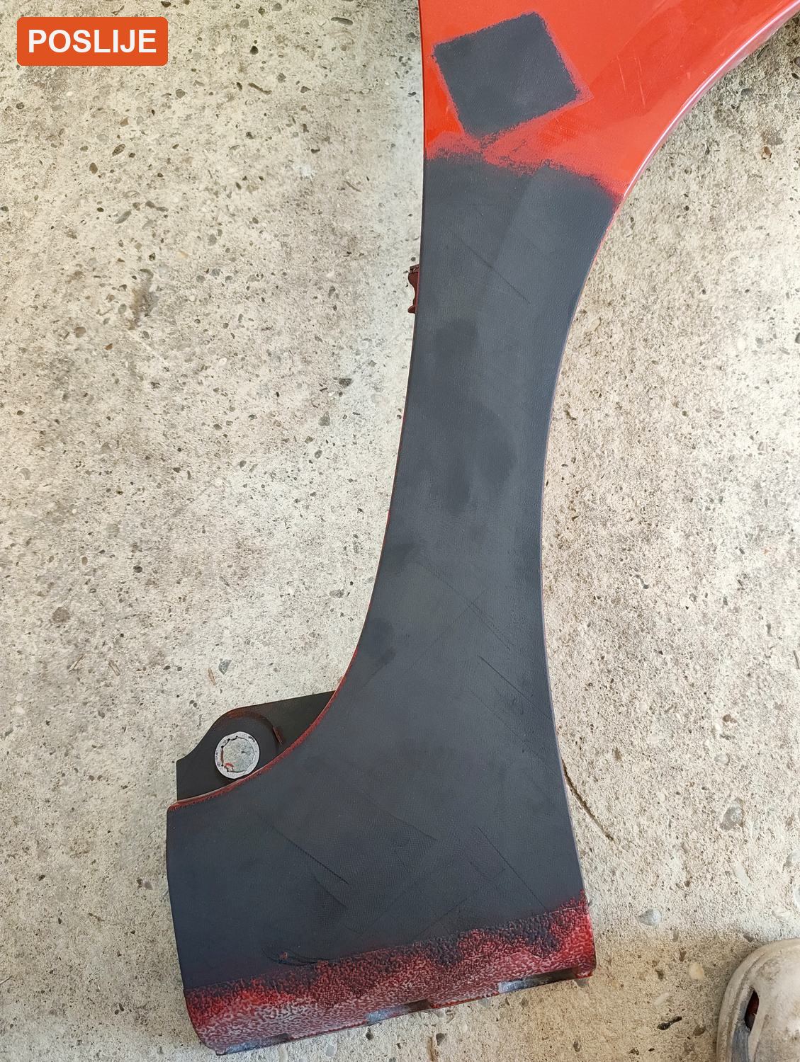 After: laser coating removal on a car fender, bare metal exposed — EKO HVOK